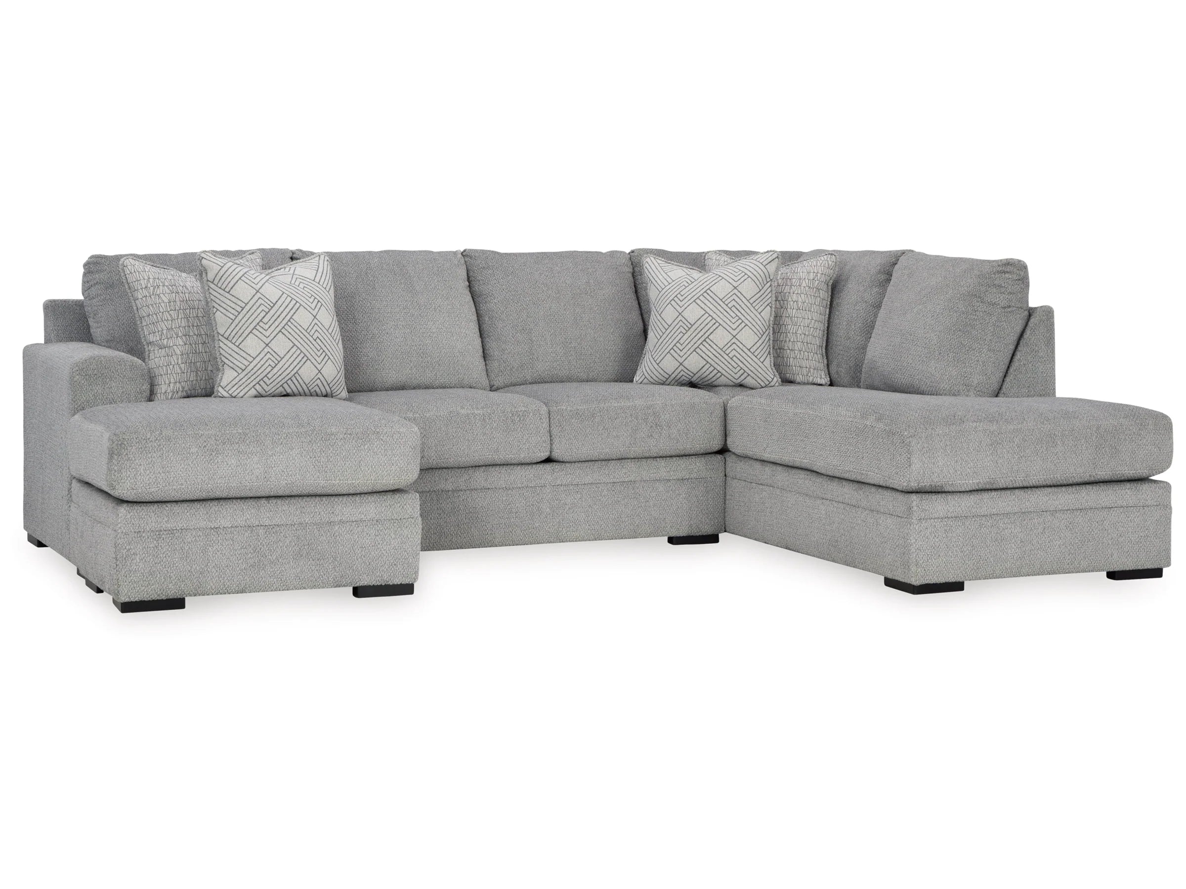 Grey plush U-shaped sectional sofa by Ashley, showing the cozy, plush fabric and spacious seating from an angled view.