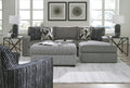 Grey Behold sofa chaise with plush cushions and modern design, perfect for a stylish living room seating area.