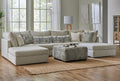 Behold modular cream sectional sofa with plush cushions and modern design, shown in a stylish living room setting.