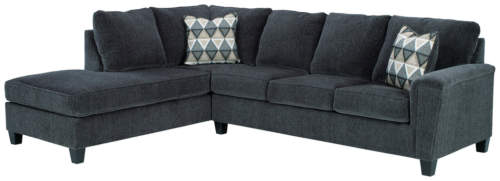 Slate grey Ashley L-shaped sectional sofa in a modern living room with plush cushions and sleek design.