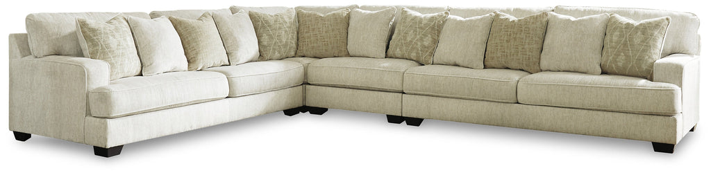 Ivory Ashley L-shaped sectional sofa with plush cushions and modern design, shown in a stylish studio setting.