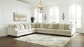Ivory L-shaped sectional sofa by Ashley, showing plush cushions and modern design in a stylish living room setting.