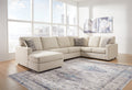 Ashley Cream U-shaped sectional sofa with plush cushions in a modern living room setting.