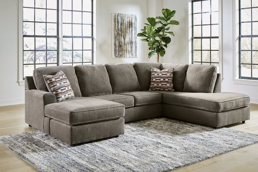Brown Ashley U-shaped sectional sofa with plush cushions and modern design, shown in a stylish living room setting.