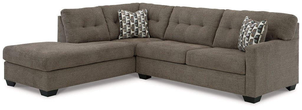 Brown Ashley L-shaped sectional sofa with plush cushions and modern design, shown in a stylish studio setting.