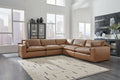 Genuine leather 5-piece sectional sofa by Ashley, featuring plush cushions and modern design in a stylish living room setting.