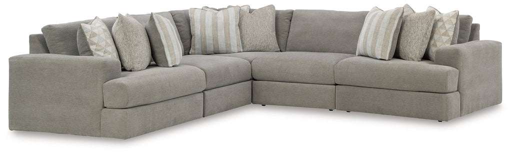 Grey Ashley L-shaped sectional sofa in a modern living room with plush cushions and sleek design.