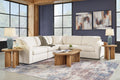 Cream Ashley modular L-shaped sectional sofa in a modern studio setting with plush cushions and sleek design.