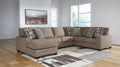 Brown Ashley U-shaped sectional sofa with plush cushions and modern design, shown in a stylish studio setting.