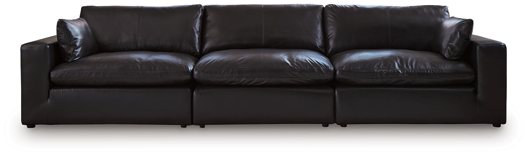 Black genuine leather sectional sofa with three sections, modern design, and plush cushions in a studio setting.