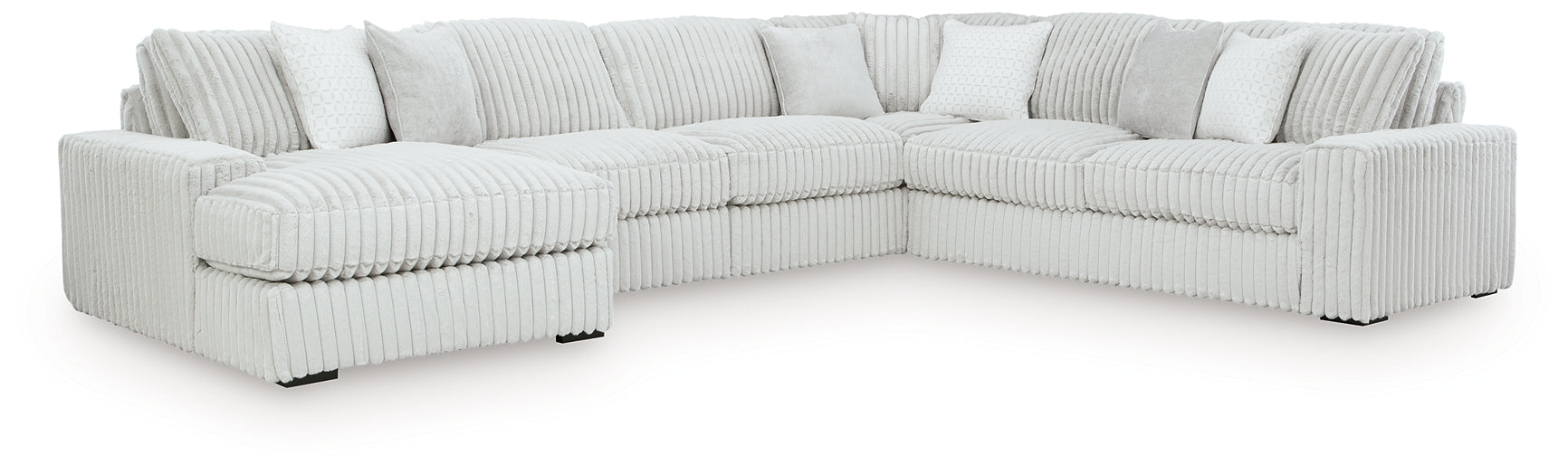 Ivory corduroy U-shaped sectional sofa by Ashley, showing plush cushions and modern design in a studio setting.